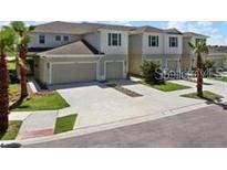 A well maintained townhome with attached garages and neatly landscaped yards at 2822 Jacob Crossing Ln, Holiday, FL 34691