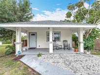 Delightful home boasting a cozy front porch, charming decor, and manicured landscaping at 4339 58 N Ave, St Petersburg, FL 33714