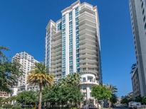 Stunning high-rise condominium with multiple balconies and lush tropical landscaping at 450 Knights Run Ave # 1003, Tampa, FL 33602