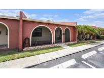 Charming single-story villa with arched entryway and well-maintained landscaping at 6346 Bonnie Bay N Cir, Pinellas Park, FL 33781