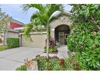 Charming single-Gathering home featuring a landscaped front yard and covered entry at 6932 Old Benton Dr, Apollo Beach, FL 33572