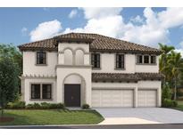 Stunning two-story home featuring a tile roof, stucco exterior, arched entryway, and three-car garage at 13746 Heartwood Way, Parrish, FL 34219