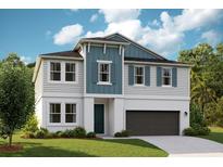 Inviting two-story home with a modern design, featuring a blue and white color scheme at 14411 Meadow Bird Ave, Riverview, FL 33579