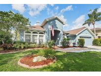 Charming single-Gathering home featuring a well-maintained lawn and inviting curb appeal in a quiet residential neighborhood at 18712 Forest Glen Ct, Tampa, FL 33647