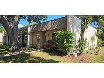 Charming home featuring classic architecture and complemented by mature trees and landscaping at 11511 113Th St # 4F, Seminole, FL 33778