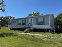 Charming single story home with inviting front entrance and tidy landscaping at 205 Portia S St, Nokomis, FL 34275