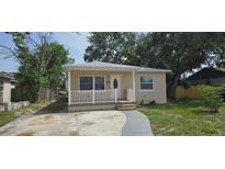 Charming single-story home featuring a cozy front porch and well-maintained landscaping at 2910 15Th Ave S, St Petersburg, FL 33712