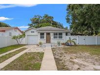 Charming single-story home featuring a well-maintained lawn and inviting curb appeal at 1419 30Th N Ave, St Petersburg, FL 33704