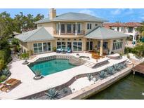 Luxury home featuring a beautiful pool, spa, and waterfront access at 2279 Mermaid Ne Pt, St Petersburg, FL 33703