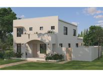 Contemporary two-story home with stucco exterior, a covered entry, and minimalist landscaping at 2560 4Th S Ave, St Petersburg, FL 33712