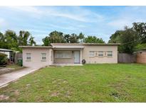 Charming single story home with a well-maintained lawn and welcoming entrance, perfect for easy living at 4323 S Lois Ave, Tampa, FL 33611