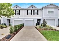 Charming townhouse with well-maintained landscaping and a one-car garage at 4743 Deer Track St, Tampa, FL 33610