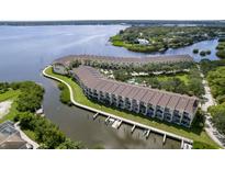 Waterfront condos boast private docks and beautiful water views from multiple units at 115 Brent Cir, Oldsmar, FL 34677