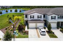 Beautiful townhome with two-car garage and lake view at 2190 Great Sapphire Ln, Lutz, FL 33558