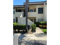 Charming condo featuring updated exteriors, lush landscaping, and private entrances at 3536 Countrybrook Ln # 13, Palm Harbor, FL 34684