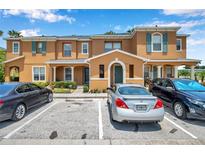 Charming townhomes with assigned parking, colorful exteriors, and well-maintained landscaping in a vibrant community at 2007 Searay Shore Dr, Clearwater, FL 33763