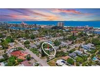 Breathtaking aerial view of the neighborhood with the beach in the distance showcasing the beautiful home at 257 43Rd Ave, St Pete Beach, FL 33706