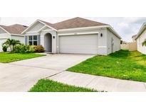 Attractive single-Gathering home with a spacious driveway and a two-car garage, perfect for modern living at 33668 Elm Hill Branch, Wesley Chapel, FL 33545