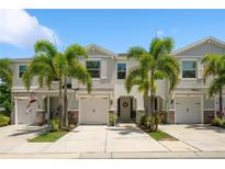 Charming townhome featuring a two-car garage, well-manicured landscaping, and inviting curb appeal at 4504 Silver Lining St, Sarasota, FL 34238
