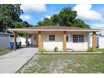 Charming single-story home with a covered front porch and well-maintained lawn at 5109 N 30Th St, Tampa, FL 33610
