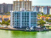 Waterfront condo featuring boat docks and scenic views of the surrounding area at 240 Sand Key Estates Dr # 243, Clearwater Beach, FL 33767