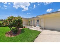 Charming single-story home featuring a well-manicured lawn and inviting curb appeal at 1270 Inverness, Dunedin, FL 34698