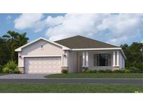 Charming single-story home featuring a two-car garage, neutral paint, stone accents, and a well-manicured lawn at 3515 Night Star Ter, Parrish, FL 34219