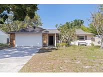 Charming single-story home with stone accents and a well-maintained front yard at 201 Westwood N Ter, St Petersburg, FL 33710
