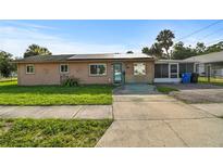 Charming single-story home with a spacious front yard, solar panels and large driveway at 2501 18Th S Ave, St Petersburg, FL 33712