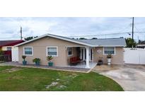 Charming single-story home with a cozy front porch and well-maintained lawn at 4403 W Minnehaha St, Tampa, FL 33614