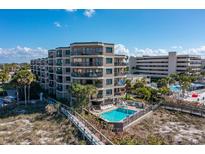 Beautiful multi-story condo building with pool, near the beach and boardwalk at 4510 Gulf Blvd # 604, St Pete Beach, FL 33706