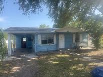 Charming single-Gathering home featuring an attached carport and covered front entrance at 5211 E 17Th Ave, Tampa, FL 33619