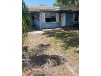 Modest one-story home with a simple facade and a small front yard space at 5211 E 17Th Ave, Tampa, FL 33619