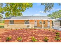 Charming single-story home features a well-manicured front yard with fresh landscaping and a welcoming entrance at 6807 River Rd, Tampa, FL 33615