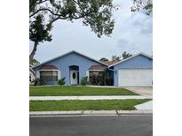 Charming single Gathering home with a well-manicured lawn and a two-car garage at 12546 108Th St, Largo, FL 33778