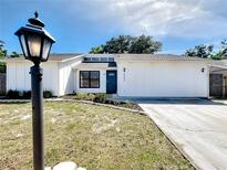 Charming single-story home boasts a well-manicured lawn and updated exterior at 6682 Mauna Loa Blvd, Sarasota, FL 34241
