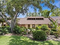 Inviting home exterior showcases lush landscaping and a charming facade, creating a welcoming curb appeal at 7705 4Th W Ave, Bradenton, FL 34209