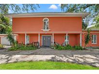 Inviting home with a charming facade, featuring a double-door entrance and a well-manicured front yard at 817 S West Shore Blvd, Tampa, FL 33609