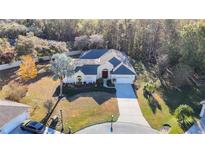 Charming one-story home featuring a manicured lawn and well-maintained landscaping at 11620 Eastern Star Ct, New Port Richey, FL 34654