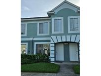 Inviting townhome exterior with well-manicured landscaping and appealing architectural details at 1907 Fluorshire Dr, Brandon, FL 33511