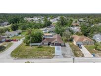 Charming single-story home featuring a pool and a spacious lot with mature trees at 9642 Elgin Blvd, Spring Hill, FL 34606
