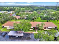 Enjoy this property's lush landscaping and convenient covered parking at 1206 10Th Se Cir, Largo, FL 33771