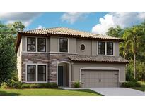 Charming two-story home featuring a stone facade, tile roof, and a two-car garage, all set amidst lush landscaping at 14788 Summer Branch Dr, Lithia, FL 33547