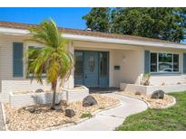 Charming single-story home features a well-manicured lawn, lovely landscaping, and a welcoming front entrance at 6236 17Th S St, St Petersburg, FL 33712
