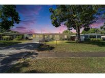 Charming single-story home with a well-maintained front yard and mature trees in a quiet neighborhood at 6554 34Th N Ave, St Petersburg, FL 33710