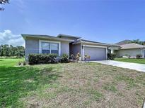 Charming one-story home featuring a two-car garage and well-maintained front yard landscaping at 6314 Gondola Dr, Riverview, FL 33578
