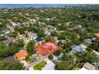 Expansive aerial view showcasing home surrounded by lush greenery near the water at 3107 S Emerson St, Tampa, FL 33629