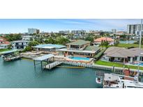 Waterfront property features a private dock, swimming pool, and panoramic city views in a desirable neighborhood at 333 Midway Is, Clearwater Beach, FL 33767