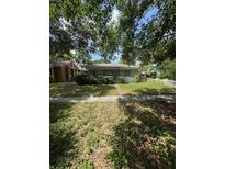 Charming single-story home with a shaded front yard, and sidewalk at 467 34Th N Ave, St Petersburg, FL 33704