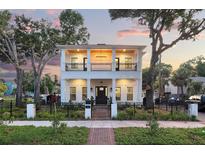 Beautiful two-story home boasts a large front porch and second story balcony with decorative iron railings at 608 Grove N St, St Petersburg, FL 33701